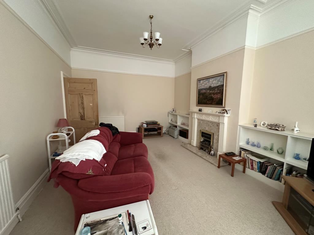 Lot: 74 - SUBSTANTIAL THREE-BEDROOM GARDEN FLAT FOR REFURBISHMENT - Living Room with fireplace